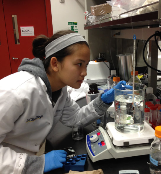 A girl conducting a science experiment in the lab