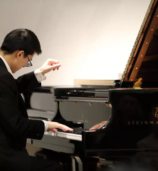 Teenager playing the piano