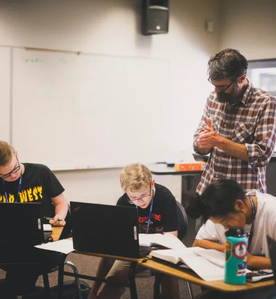 A photo of students with an instructor in the classroom