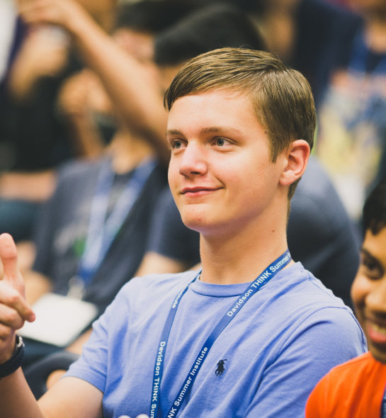 A boy giving a thumbs up