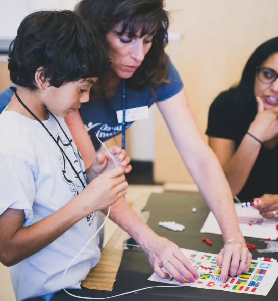 An instructor helping a student with his project