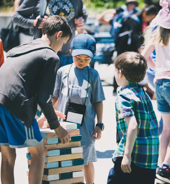 Youth playing Jenga at the Davidson Institute