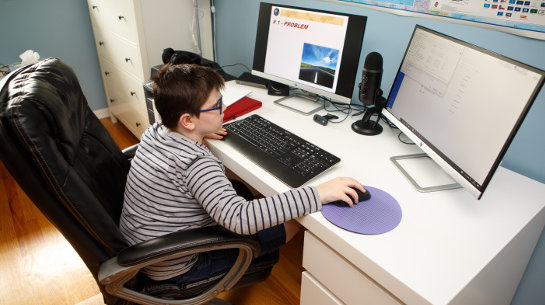 A student at home working at the computer