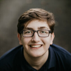 Portrait of boy looking up at the camera and smiling